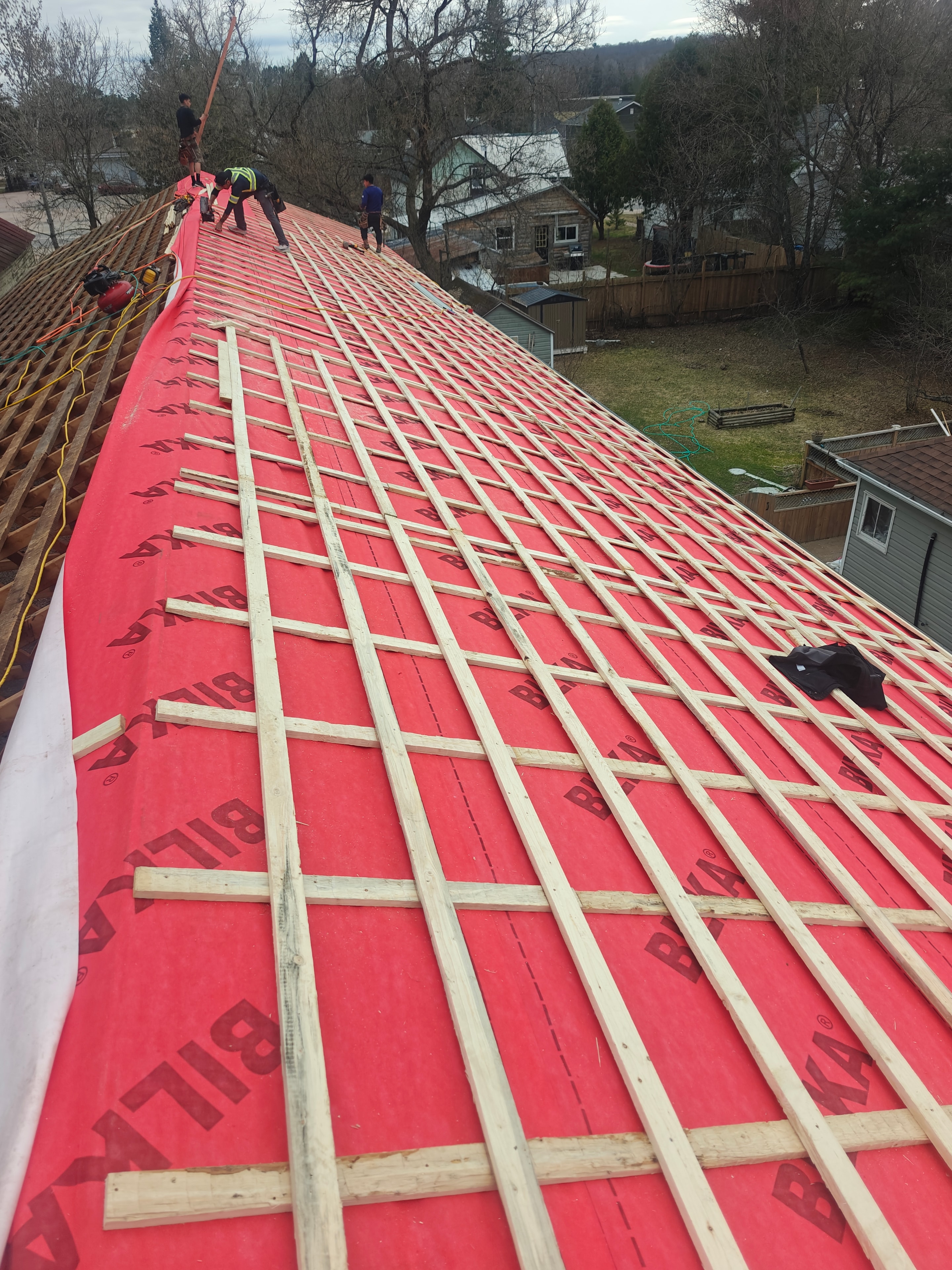 Metal roof underlayment and batten installation