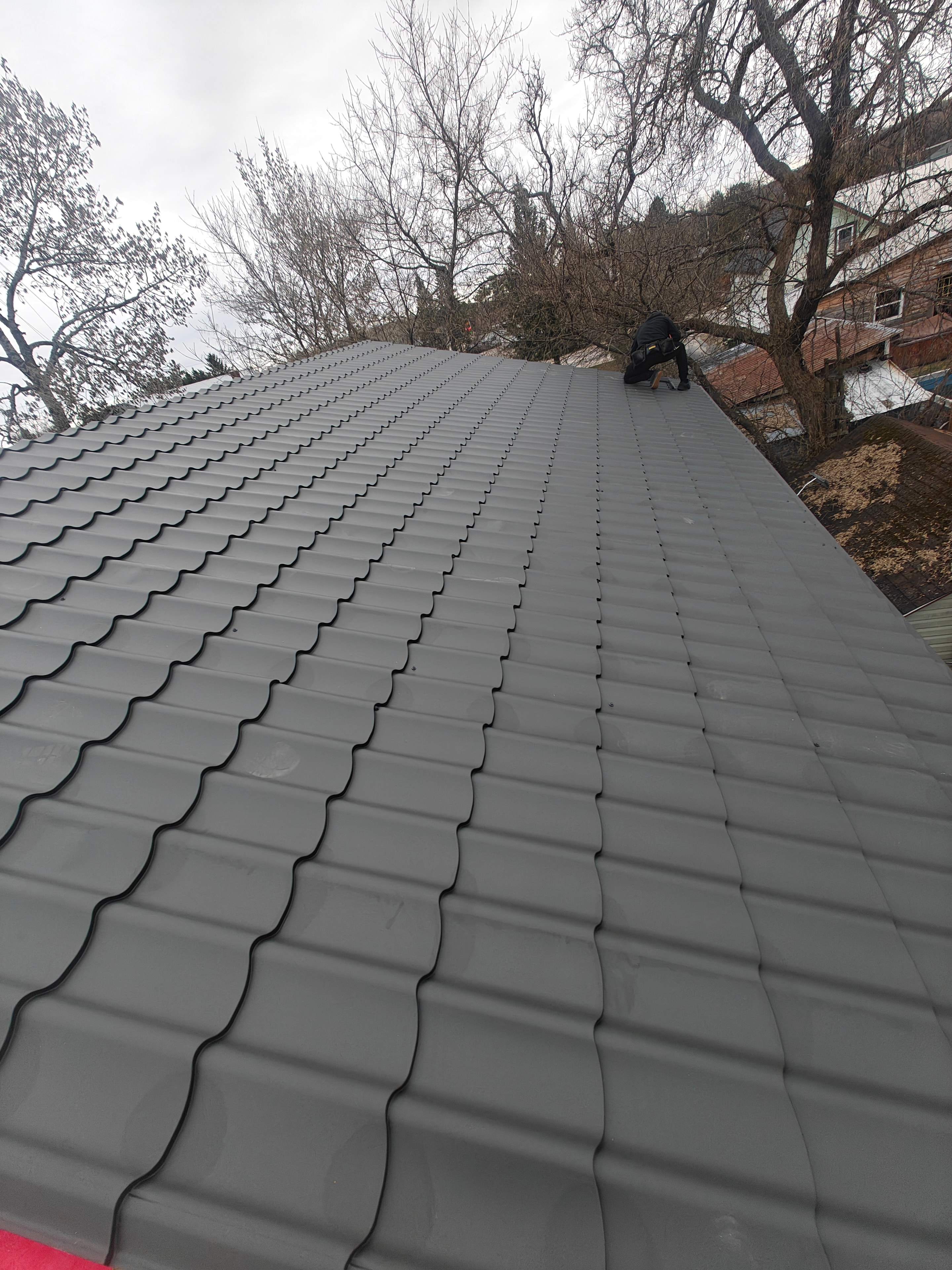 Metal roof installation near completion